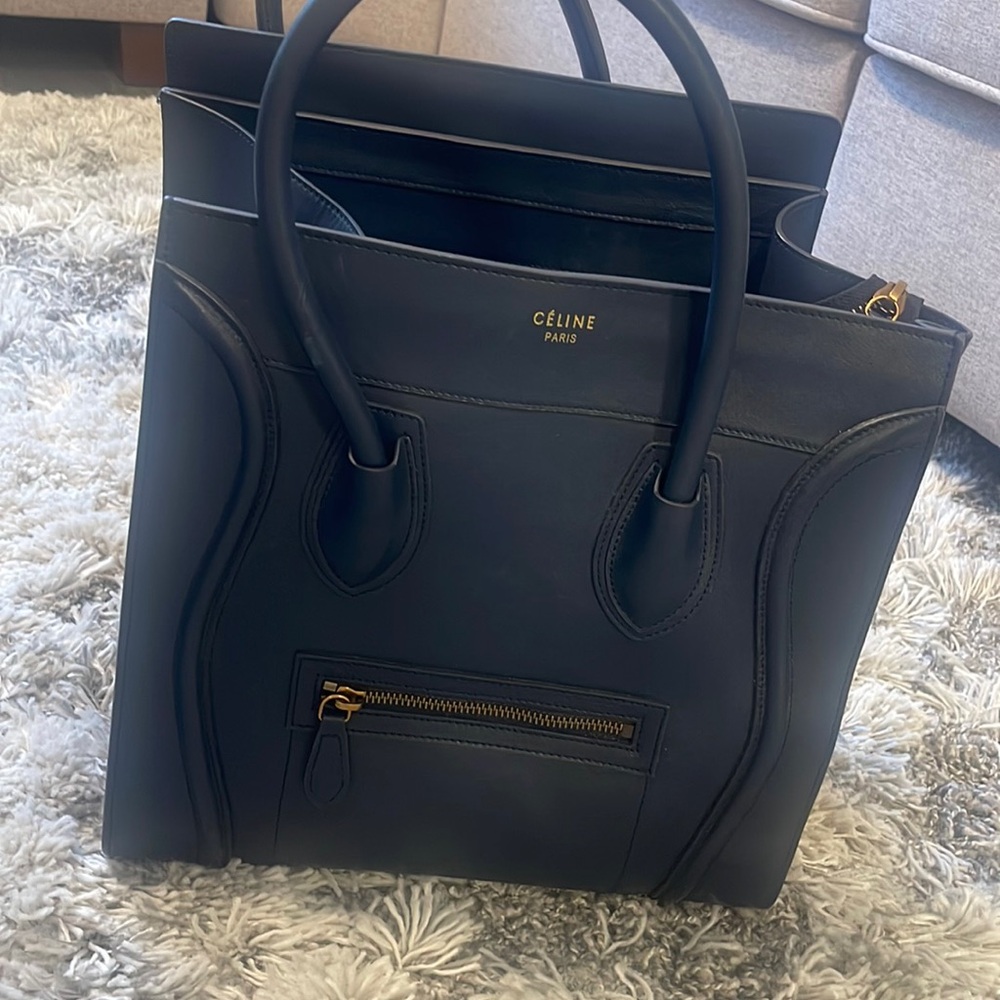 Worn twice the bag is brand new that bag is not being used collecting dust